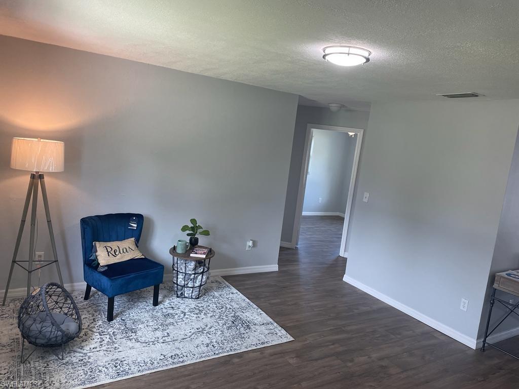 18613 Sebring Road Fort Myers, FL 33967 - Photo 11 of 12 a living room with furniture and wooden floor
