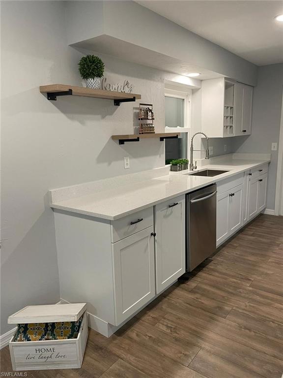 18613 Sebring Road Fort Myers, FL 33967 - Photo 2 of 12 a kitchen with a sink and cabinets