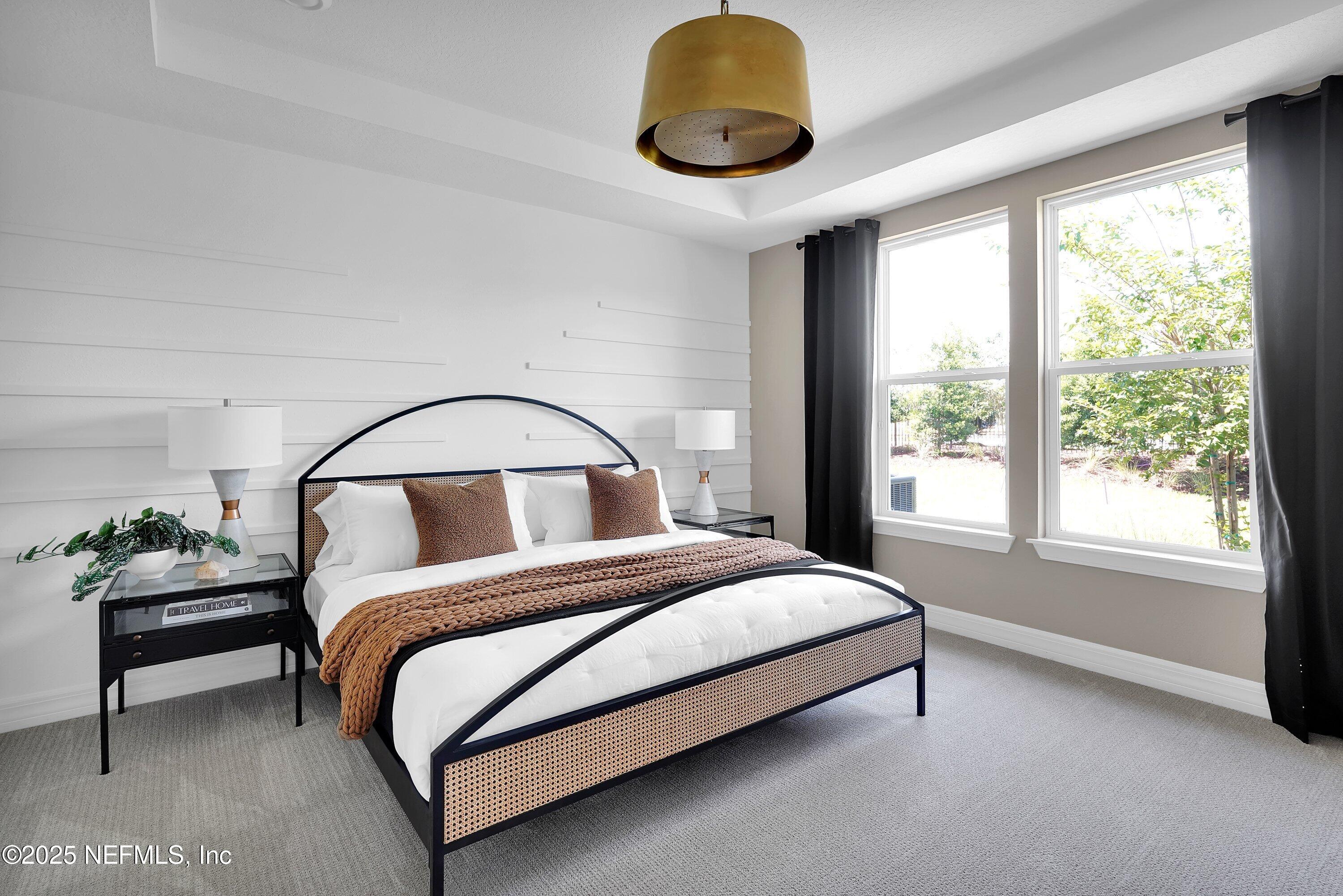 918 Floco Avenue Yulee, FL 32097 - Photo 11 of 37 a bedroom with a bed and window