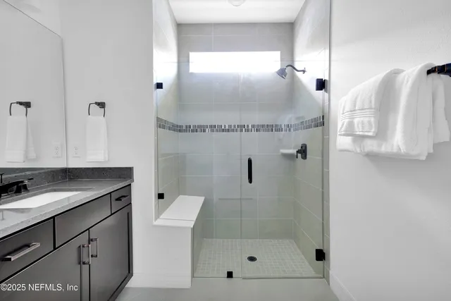 a living room with furniture potted plant and a window