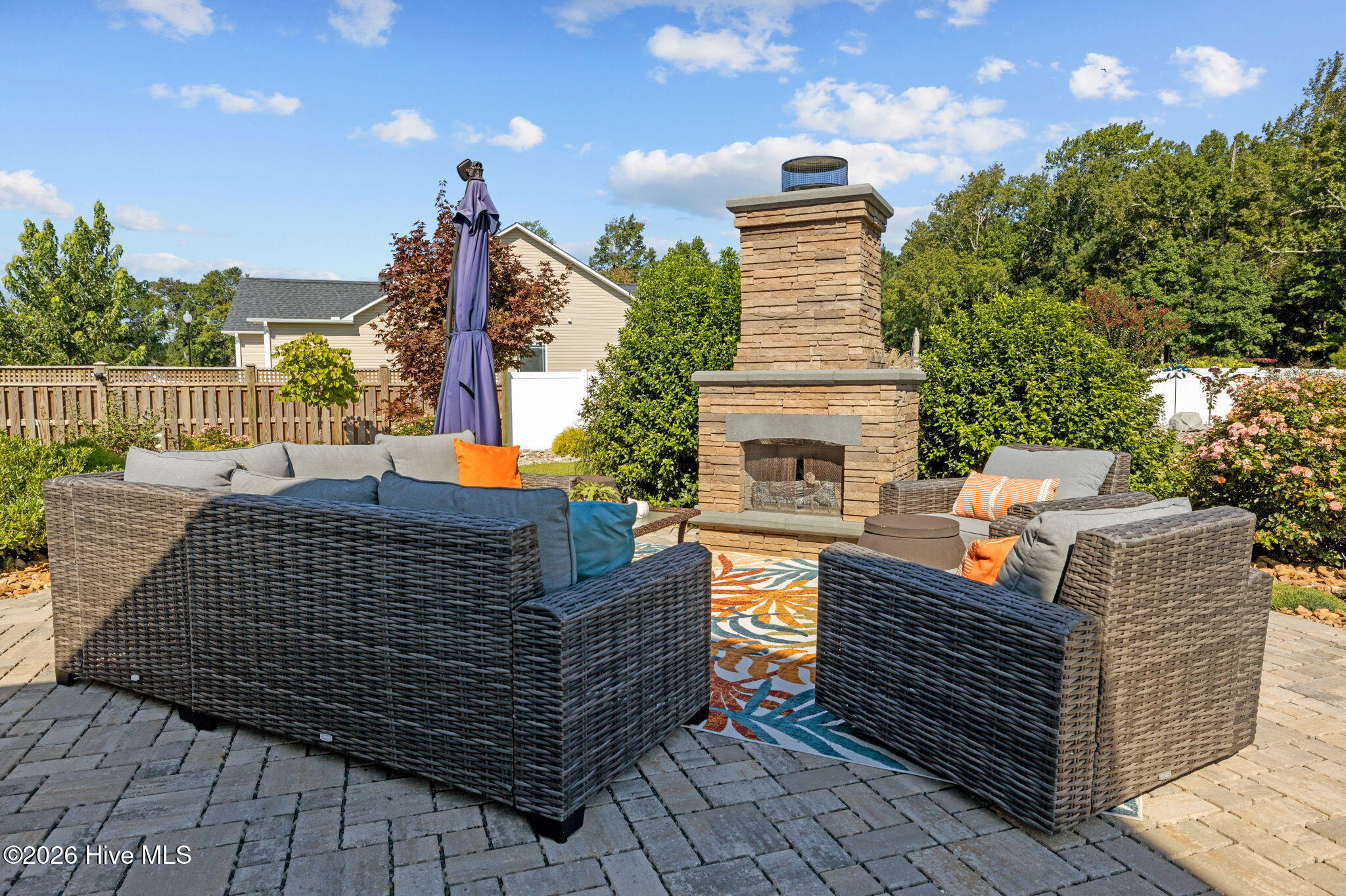 109 Ridgeline Drive Beaufort, NC 28516 - Photo 40 of 65 Custom cobblestone walkway and seating area with gas fueled fireplace.