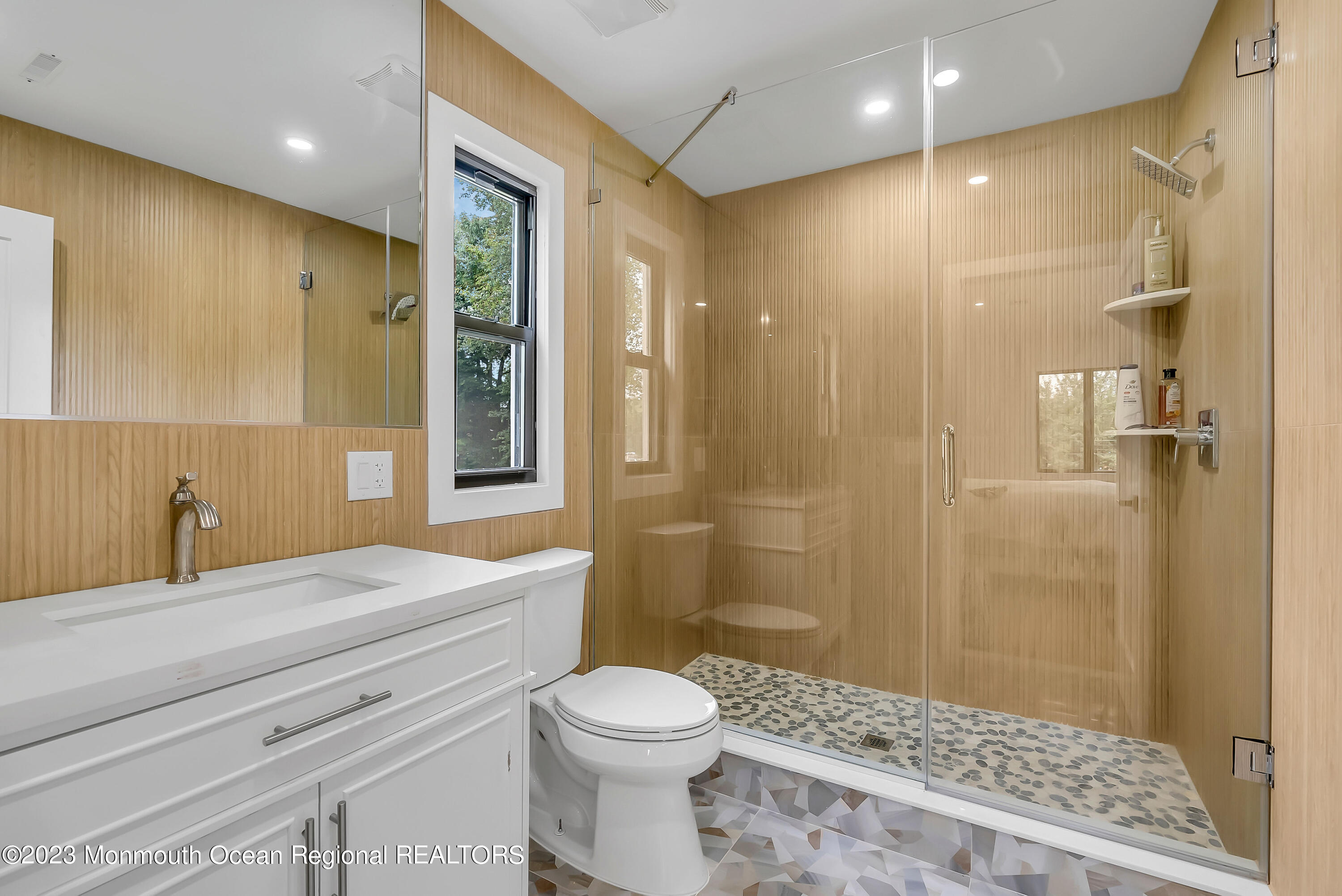 265 Whalepond Road Oakhurst, NJ 07755 - Photo 16 of 34 a bathroom with a sink a toilet and shower