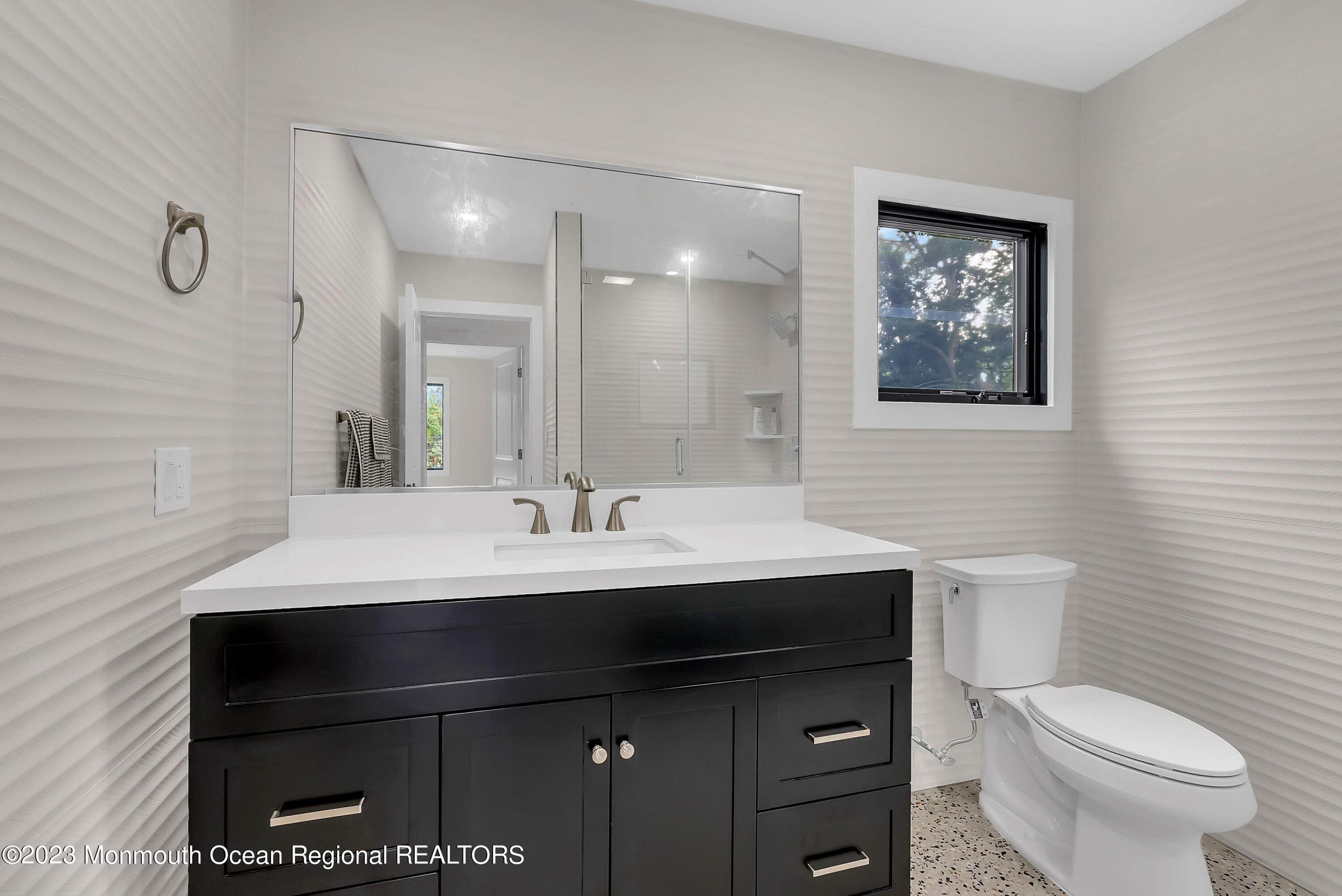 265 Whalepond Road Oakhurst, NJ 07755 - Photo 17 of 34 a bathroom with a sink and a toilet