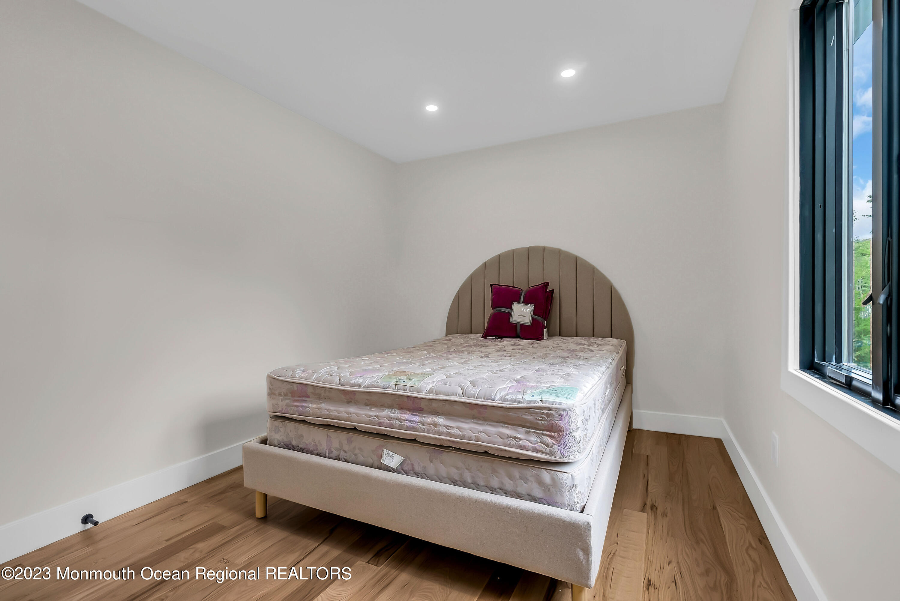 265 Whalepond Road Oakhurst, NJ 07755 - Photo 20 of 34 a bedroom with a bed and a window