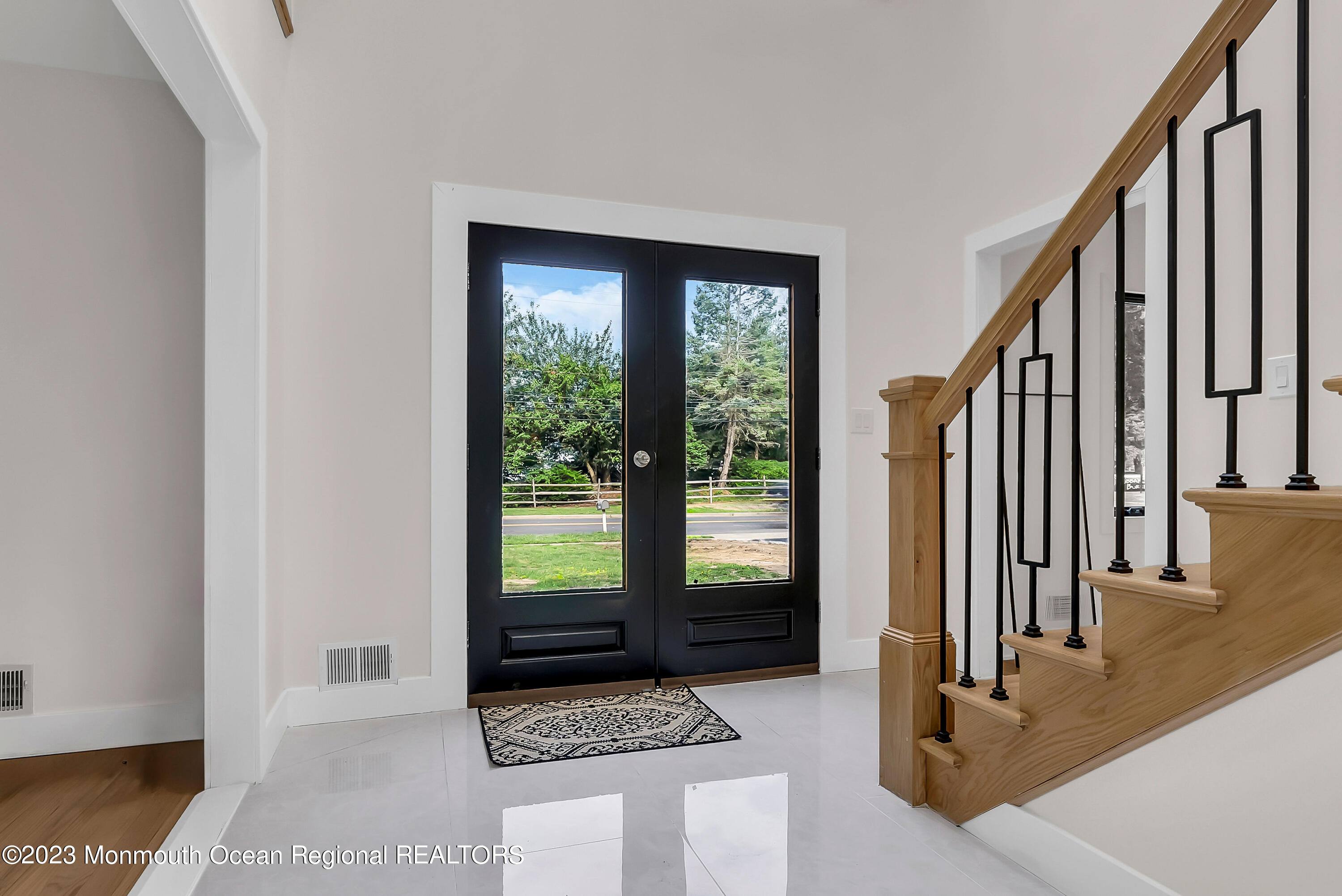265 Whalepond Road Oakhurst, NJ 07755 - Photo 2 of 34 a view of entryway with wooden floor and stairs