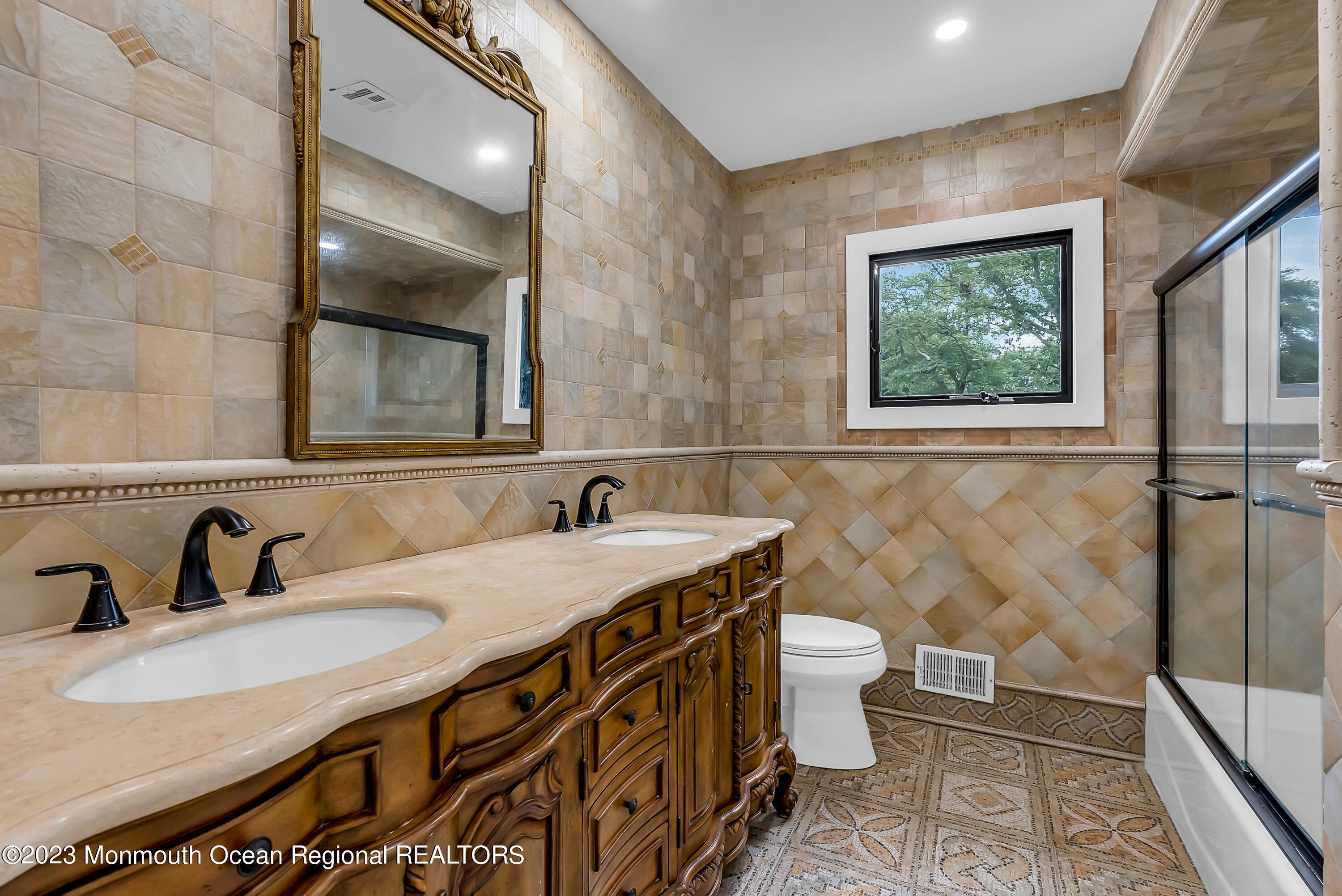 265 Whalepond Road Oakhurst, NJ 07755 - Photo 26 of 34 a bathroom with a sink and a mirror