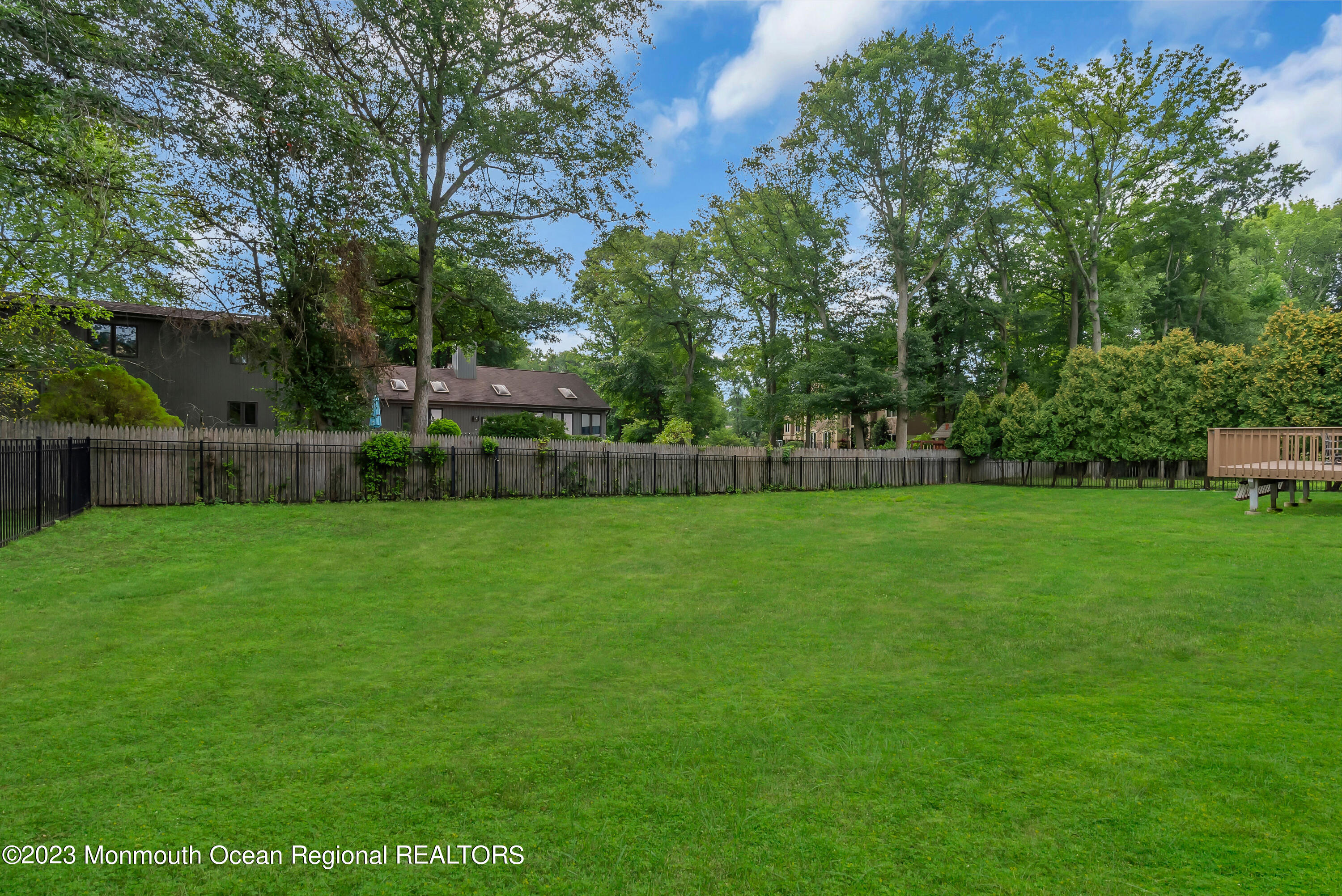 265 Whalepond Road Oakhurst, NJ 07755 - Photo 28 of 34 a view of green field with house in the background