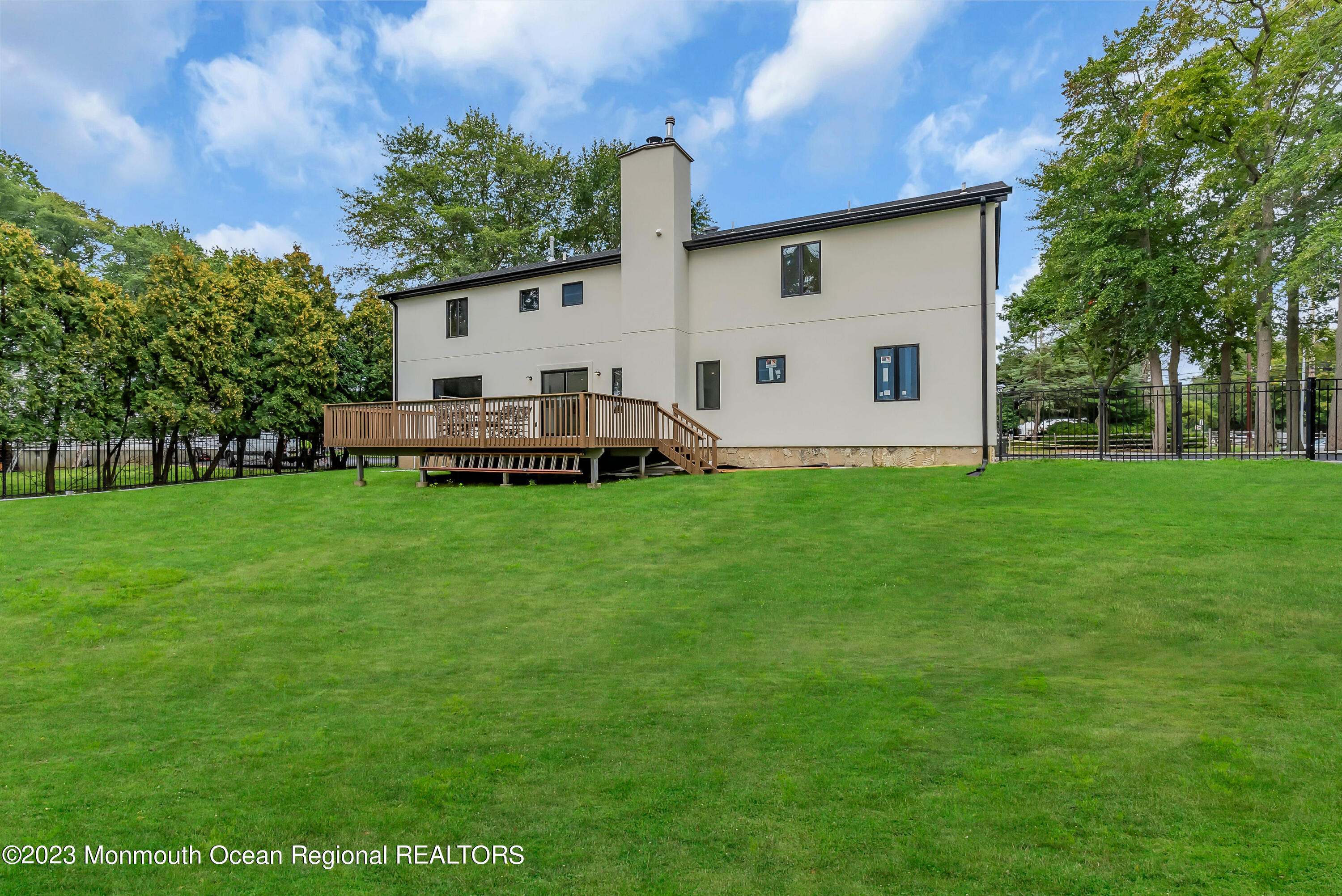 265 Whalepond Road Oakhurst, NJ 07755 - Photo 29 of 34 a view of a house with a backyard