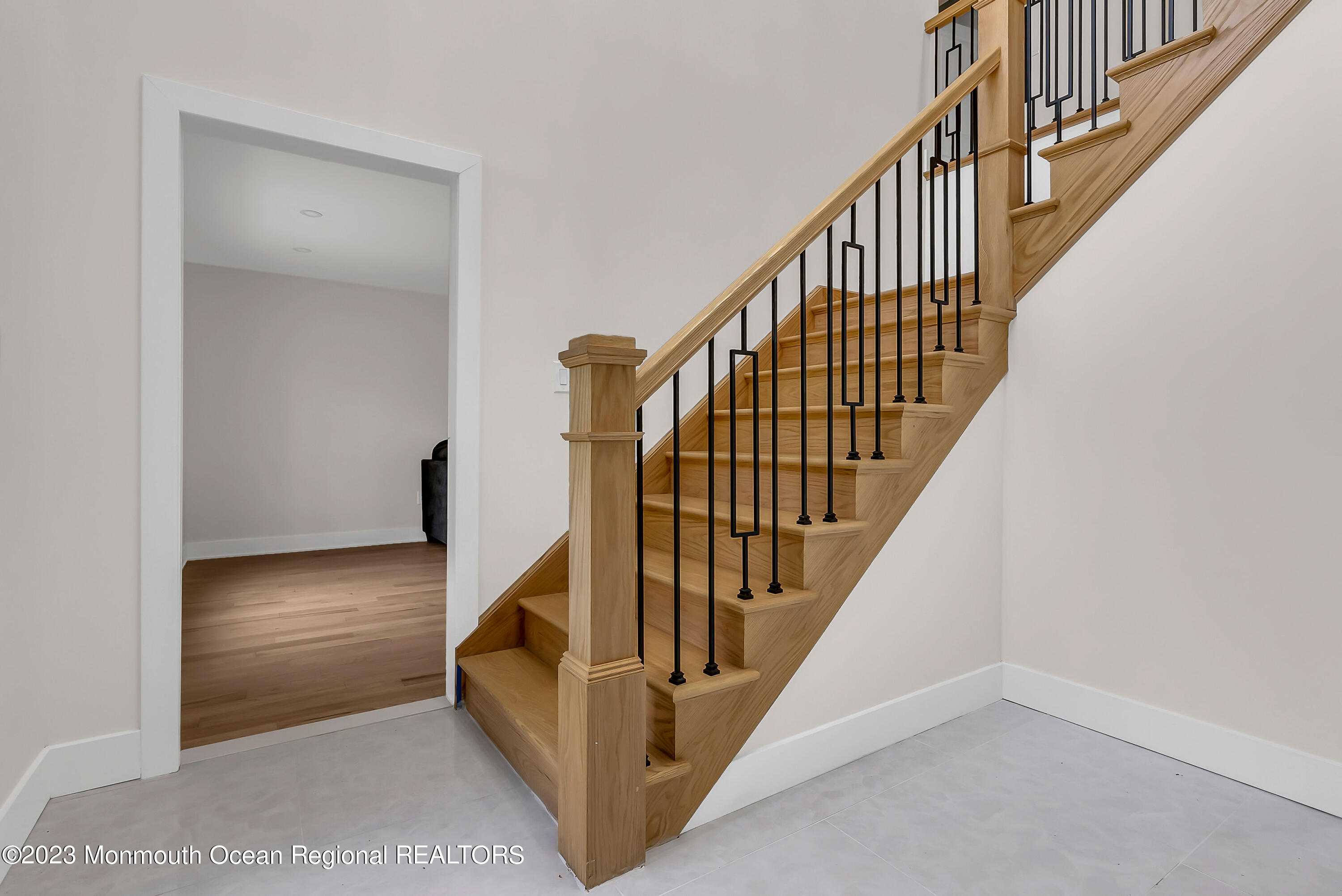 265 Whalepond Road Oakhurst, NJ 07755 - Photo 4 of 34 a view of staircase with railing and white walls