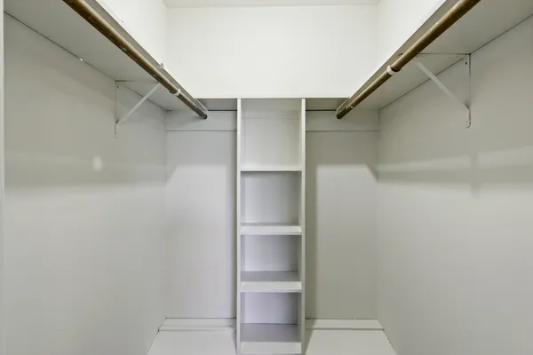 a view of an empty walk in closet