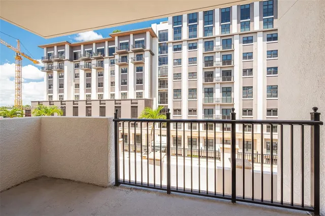 a view of a large building from a balcony