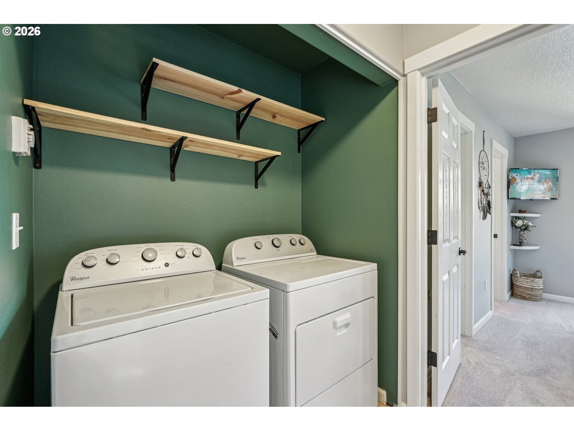 10739 Southwest Canterbury Lane, Unit 101 Portland, OR 97224 - Photo 11 of 27 a utility room with dryer and washer
