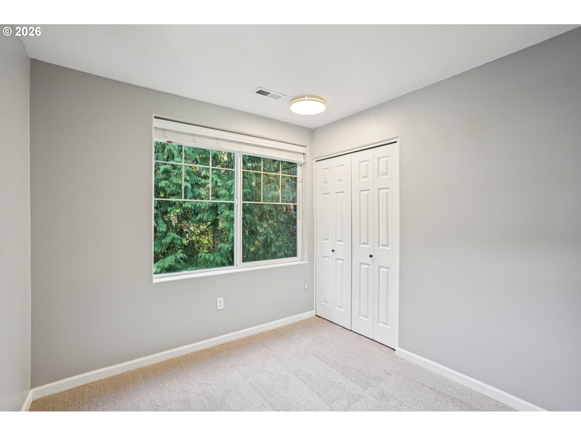 10739 Southwest Canterbury Lane, Unit 101 Portland, OR 97224 - Photo 20 of 27 a big room with wooden floor and windows
