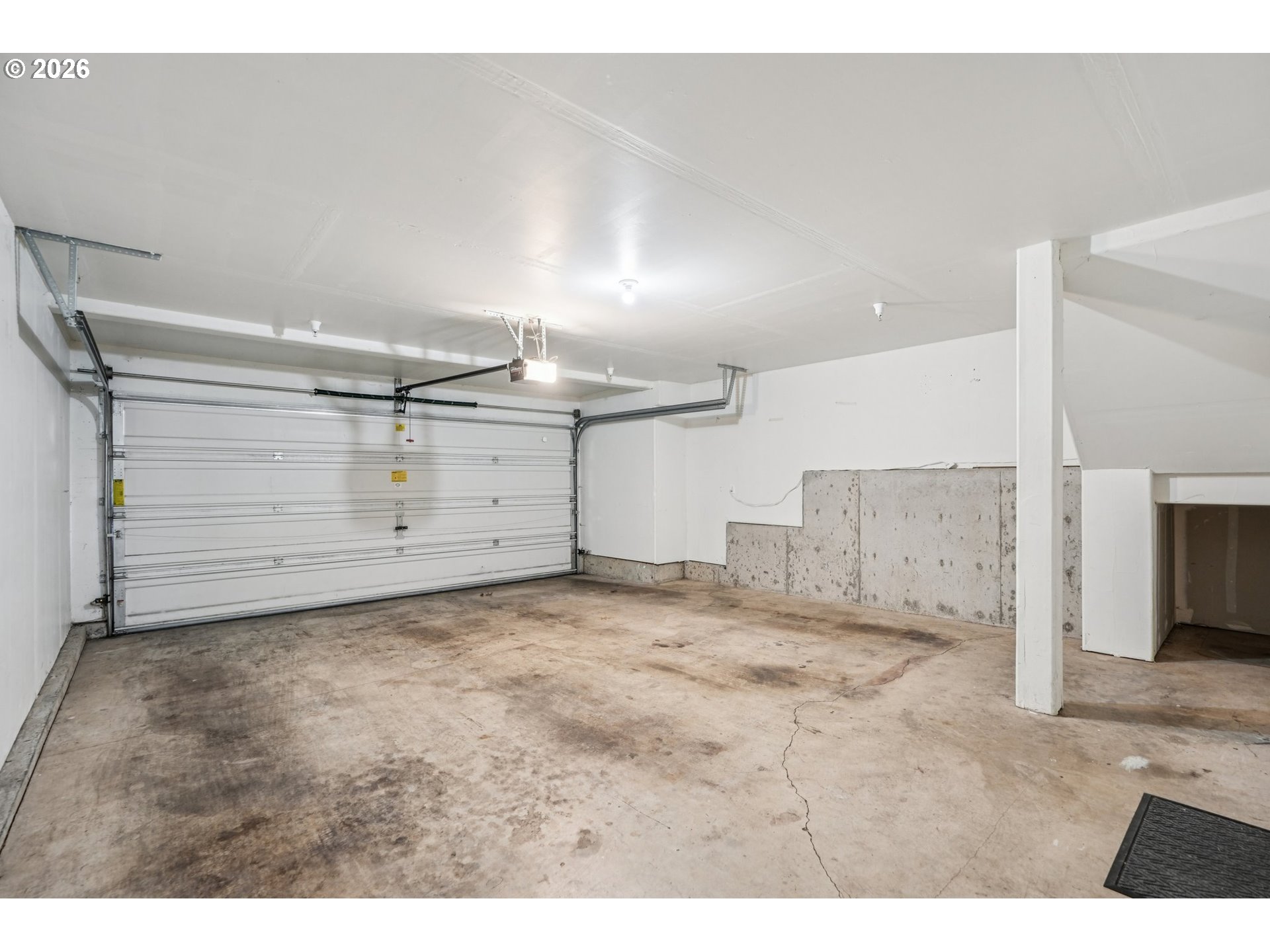 10739 Southwest Canterbury Lane, Unit 101 Portland, OR 97224 - Photo 21 of 27 a view of a room with an empty space
