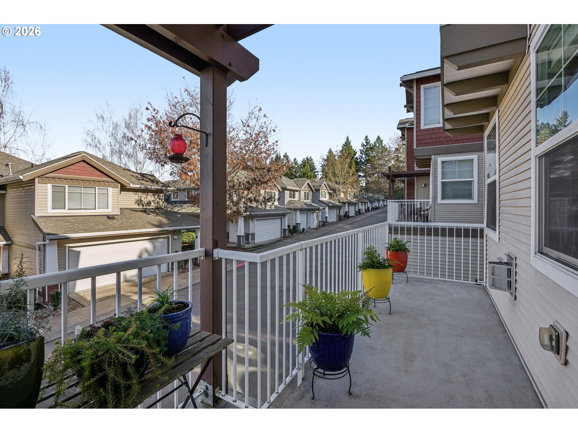 10739 Southwest Canterbury Lane, Unit 101 Portland, OR 97224 - Photo 23 of 27 a view of a two chairs and table in the balcony