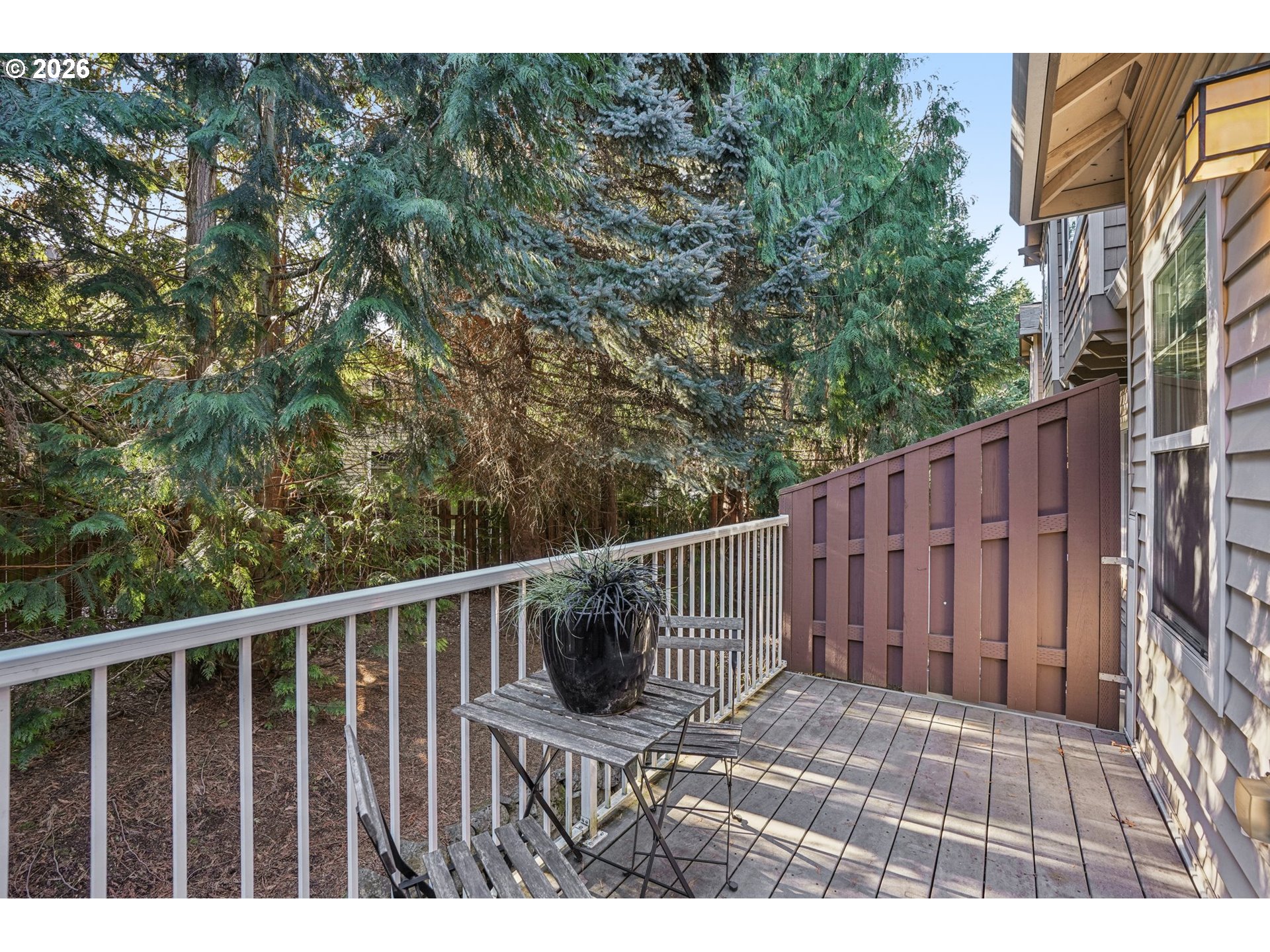 10739 Southwest Canterbury Lane, Unit 101 Portland, OR 97224 - Photo 24 of 27 a view of a wooden fence