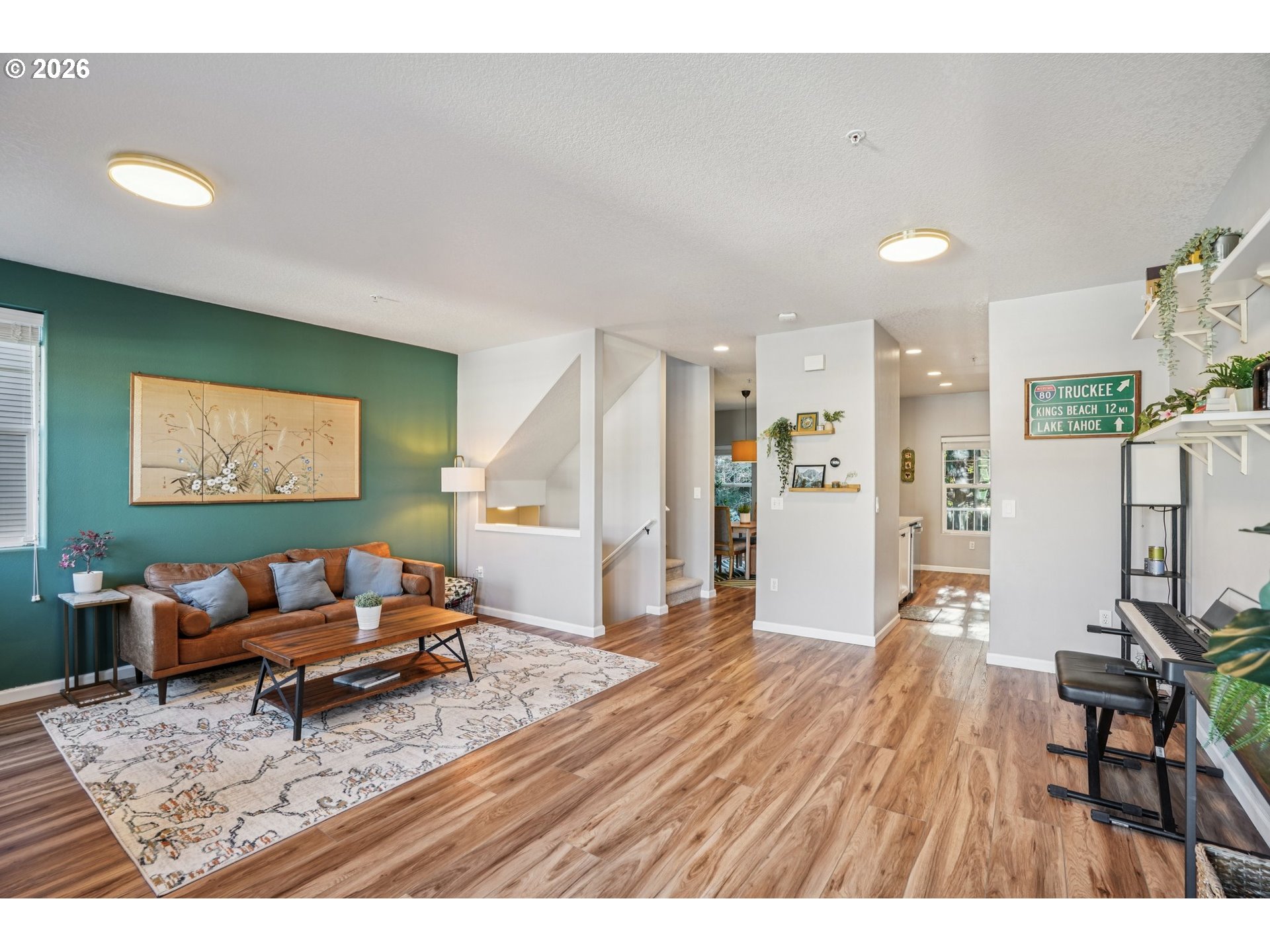 10739 Southwest Canterbury Lane, Unit 101 Portland, OR 97224 - Photo 6 of 27 a living room with furniture and a wooden floor