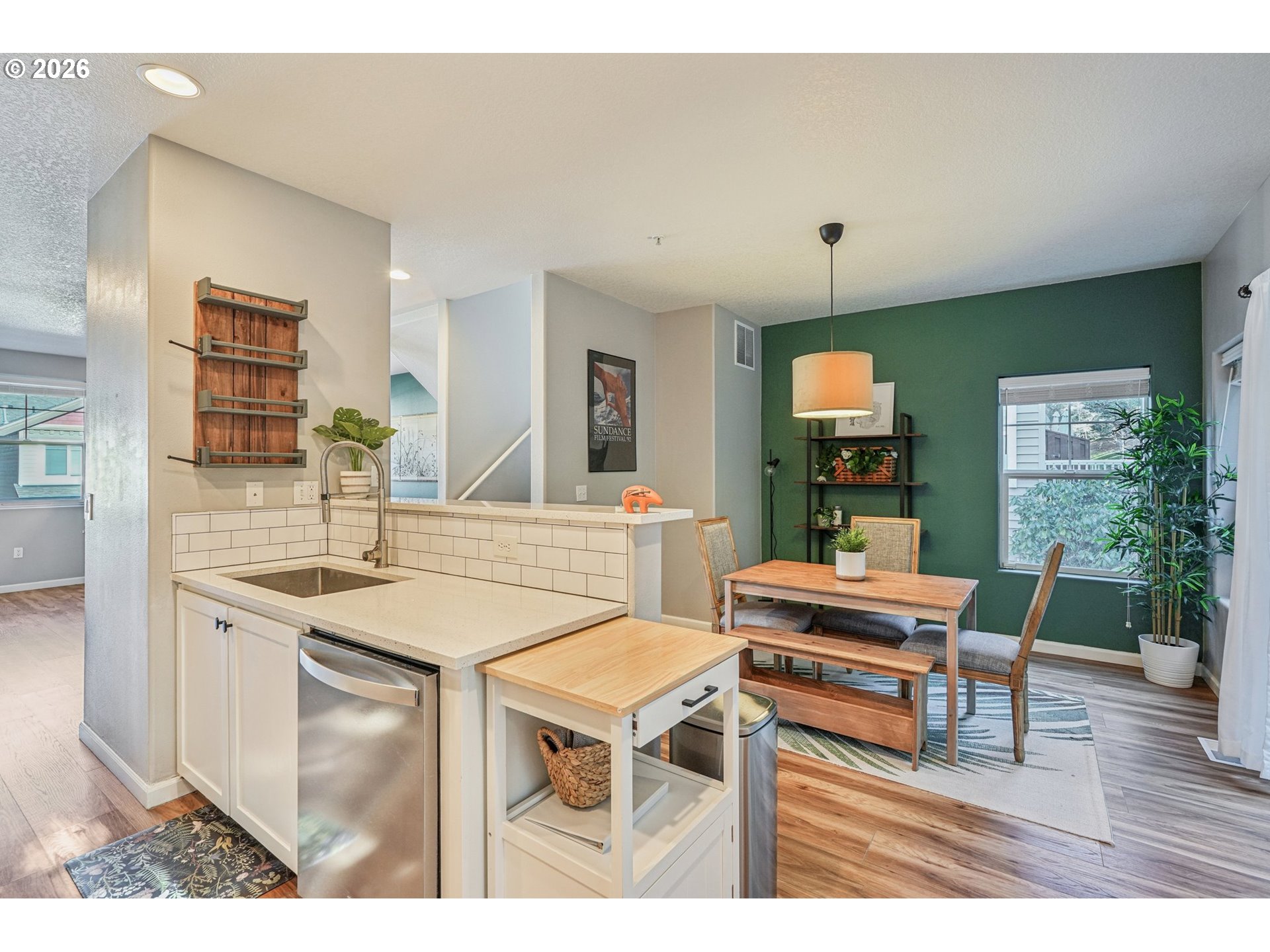 10739 Southwest Canterbury Lane, Unit 101 Portland, OR 97224 - Photo 8 of 27 a view of a dining room with furniture window and wooden floor