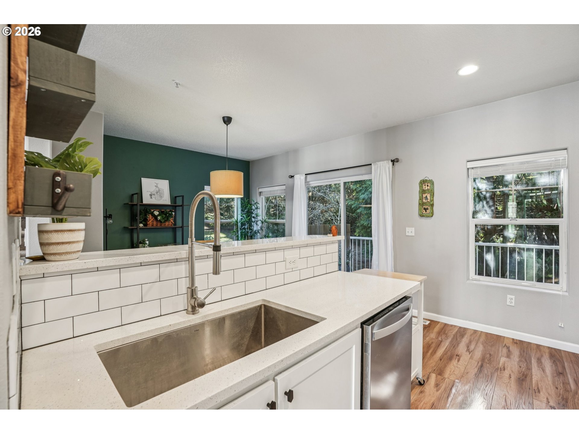 10739 Southwest Canterbury Lane, Unit 101 Portland, OR 97224 - Photo 10 of 27 a kitchen with a sink and large window