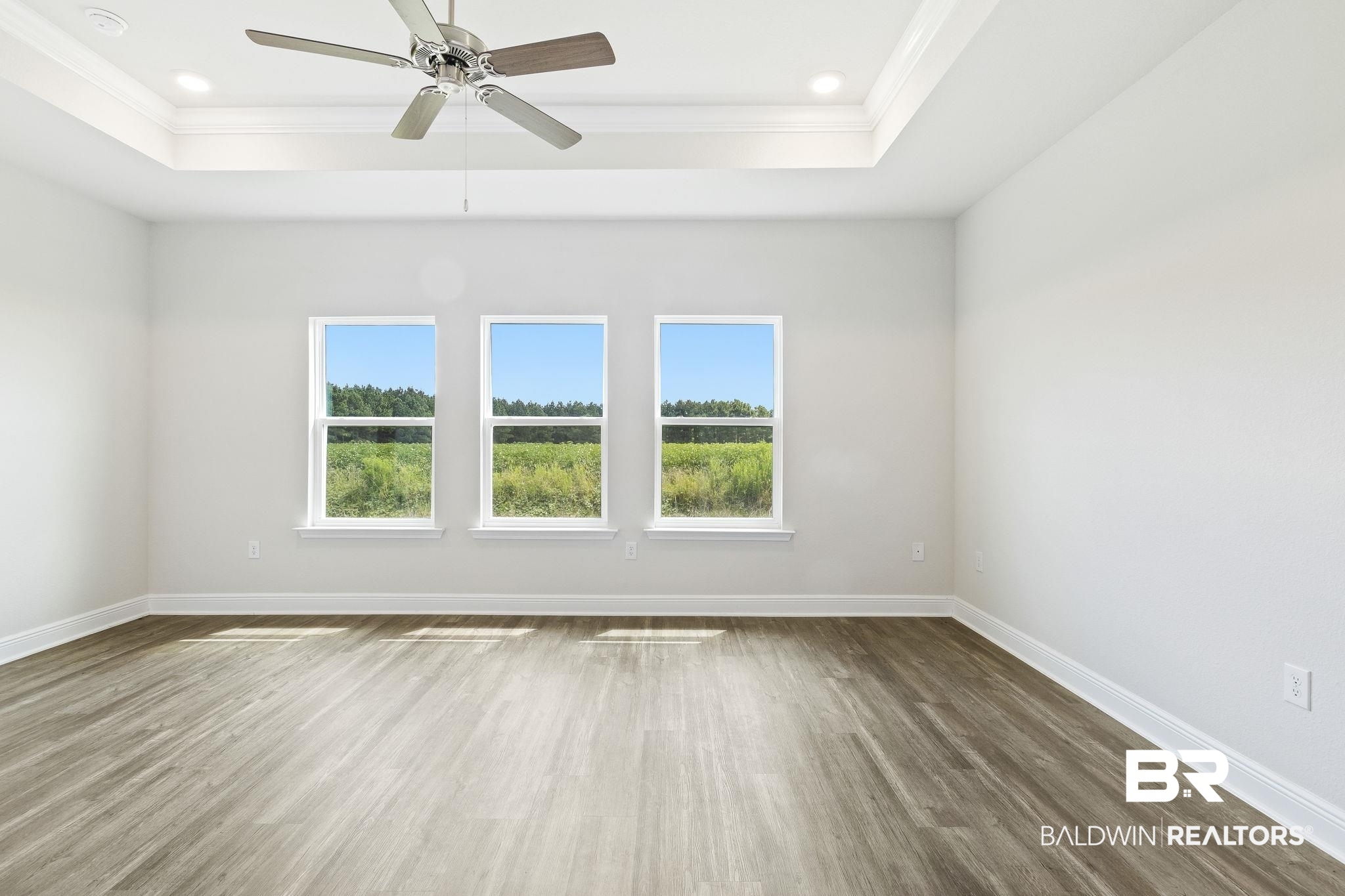 11303 Genuine Risk Circle Daphne, AL 36526 - Photo 37 of 100 The primary bedroom overlooks farmland and has lots of natural light.