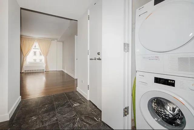 a view of a hallway with washer and dryer