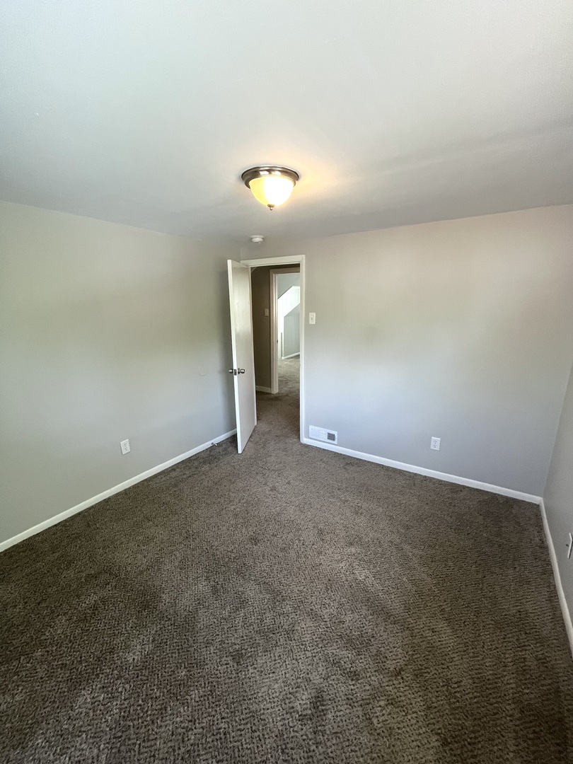 21142 Locust Street Matteson, IL 60443 - Photo 14 of 18 an empty room with an natural light