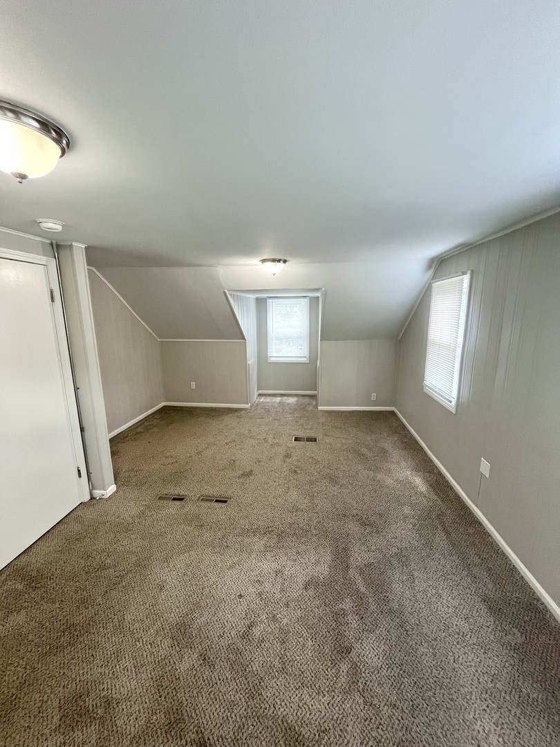 21142 Locust Street Matteson, IL 60443 - Photo 8 of 18 an empty room with a empty space and windows