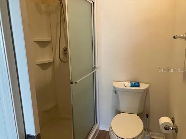 a white toilet sitting next to a bathroom sink