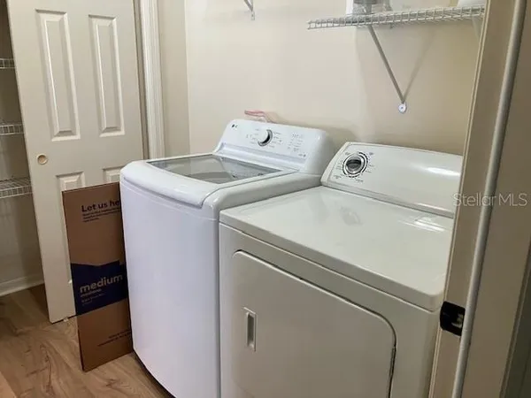 a utility room with dryer and washer