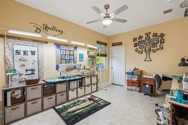 a bed room with a bed and a chair