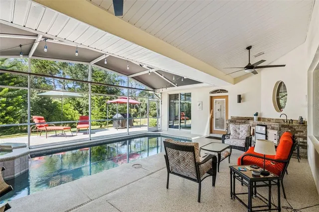 a view of a swimming pool with a patio