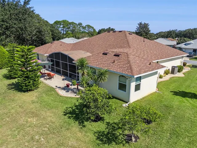 an aerial view of a house with a swimming pool