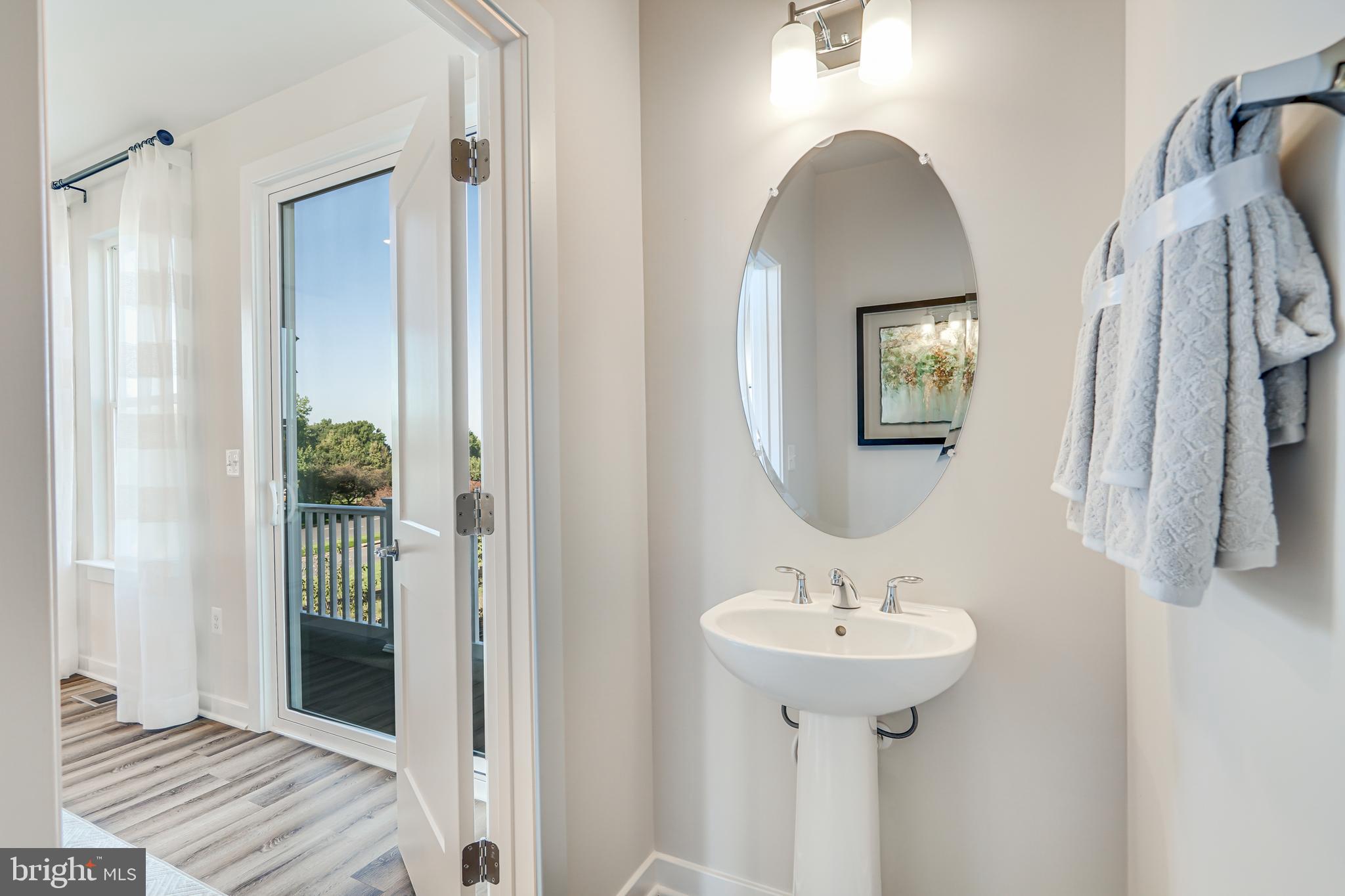 13656 Cobble Loop Woodbridge, VA 22193 - Photo 23 of 44 a bathroom with a sink and a mirror