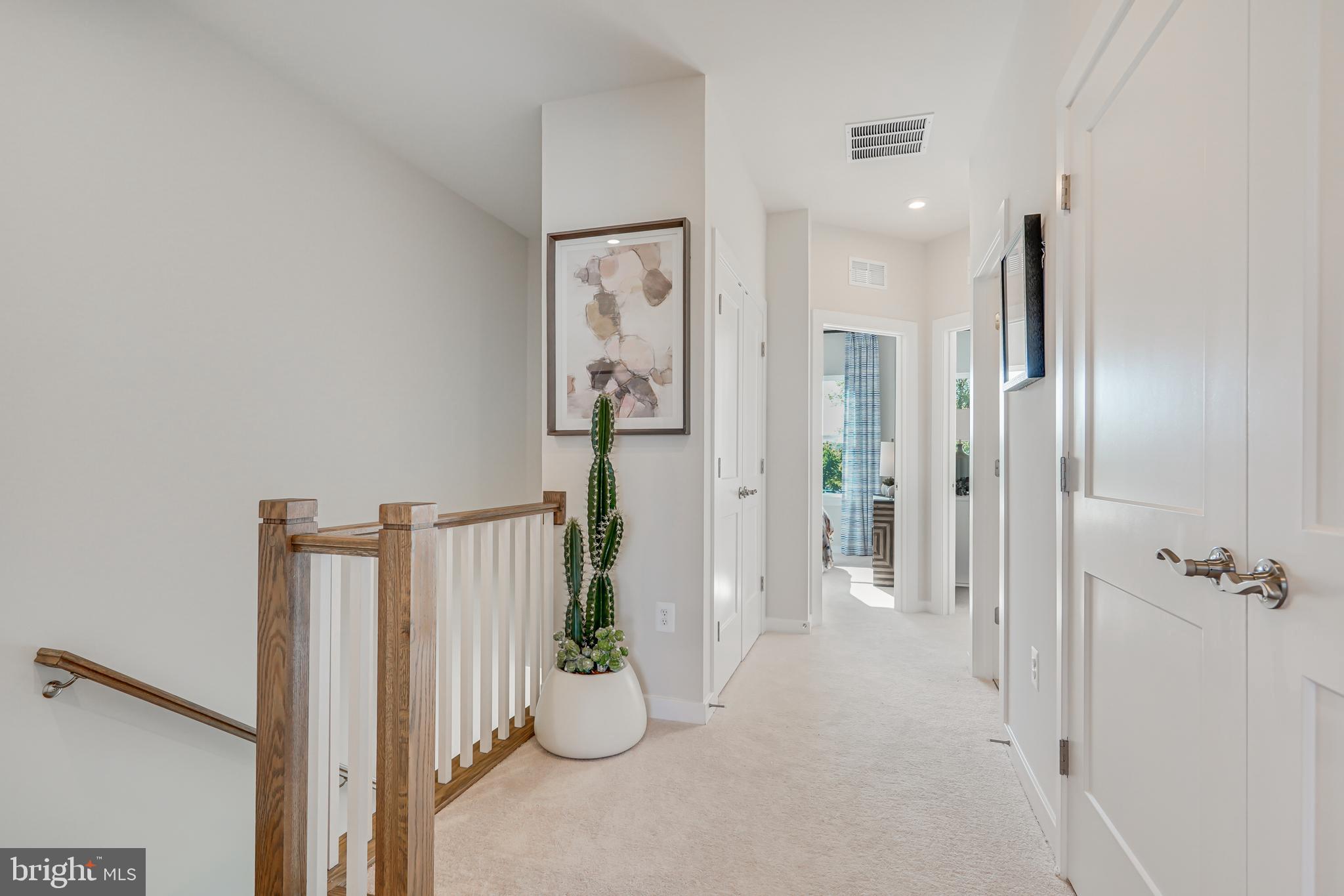 13656 Cobble Loop Woodbridge, VA 22193 - Photo 24 of 44 a view of a hallway with wooden shelves