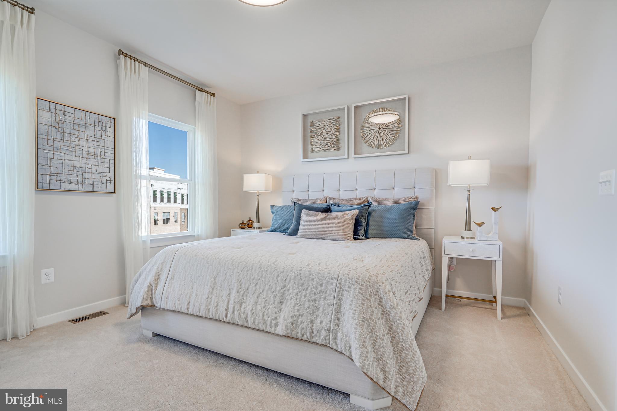 13656 Cobble Loop Woodbridge, VA 22193 - Photo 27 of 44 a bedroom with a bed and a night stand