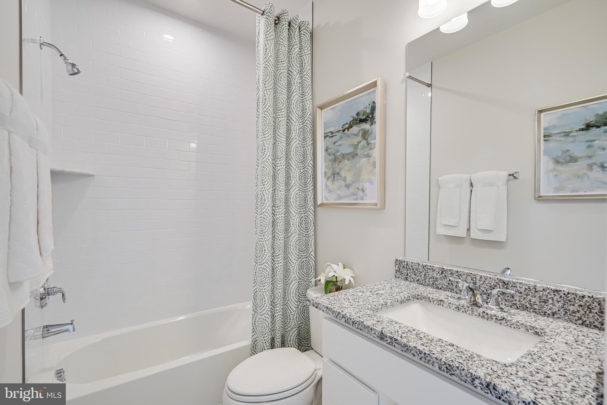 13656 Cobble Loop Woodbridge, VA 22193 - Photo 37 of 44 a bathroom with a granite countertop sink toilet and shower