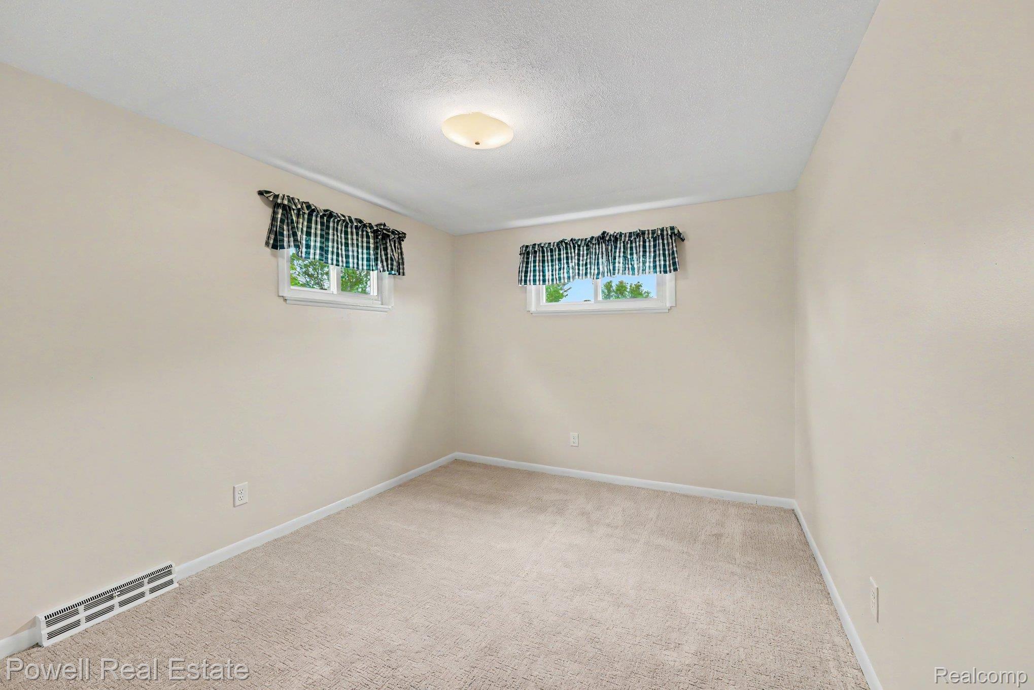 18166 Davidson Road Fraser, MI 48026 - Photo 16 of 27 Bright bedroom featuring new carpet and paint
