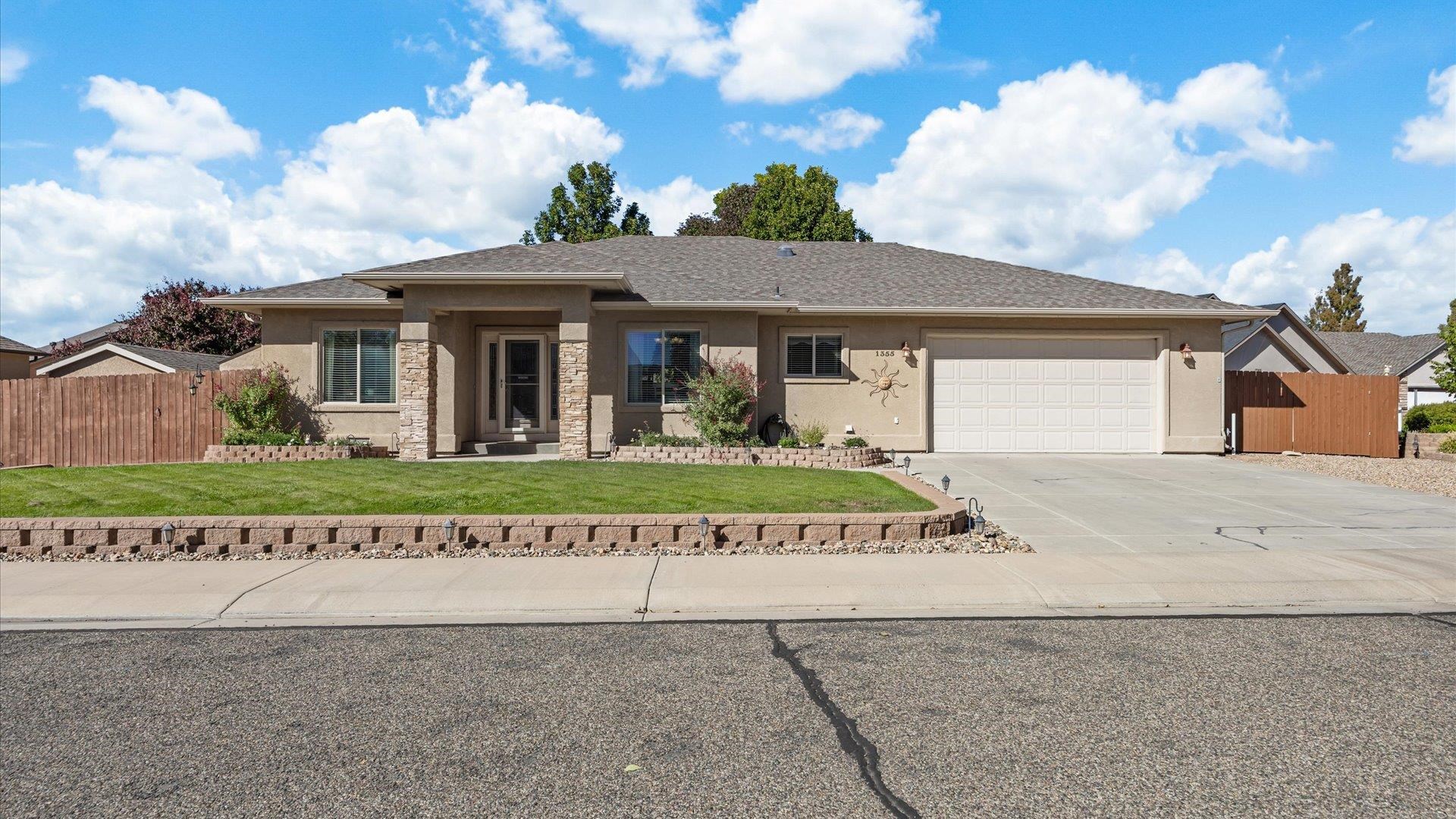 1355 Monument Court Fruita, CO 81521 - Photo 1 of 27 front view of a house with a small yard