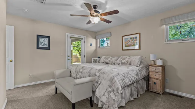 a bedroom with a bed and a couch