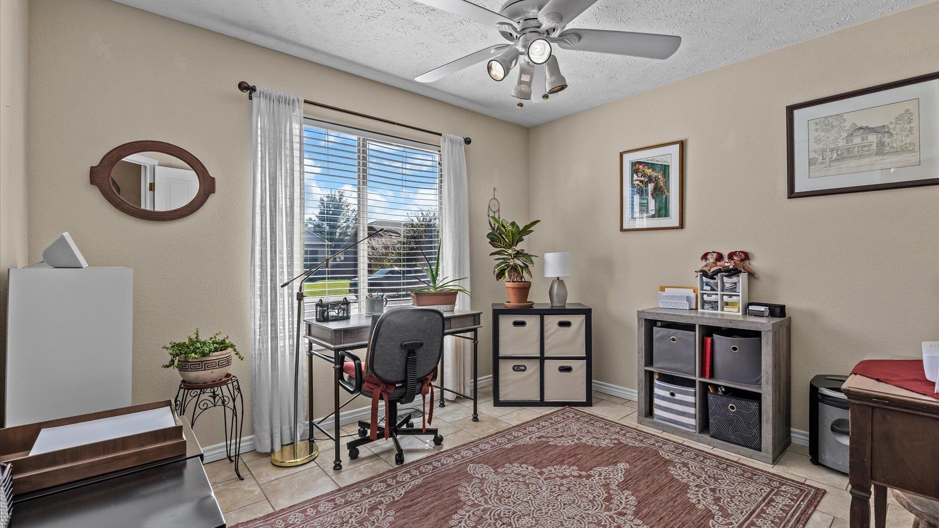 1355 Monument Court Fruita, CO 81521 - Photo 19 of 27 a view of a workspace with furniture and a window