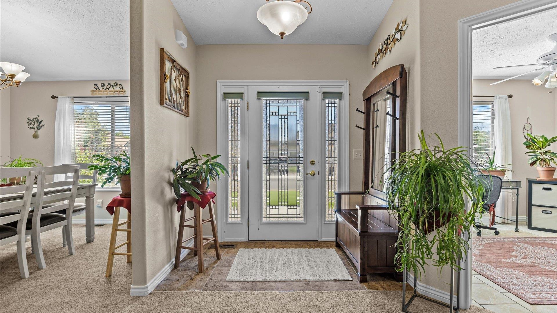 1355 Monument Court Fruita, CO 81521 - Photo 5 of 27 a living room with furniture and potted plant