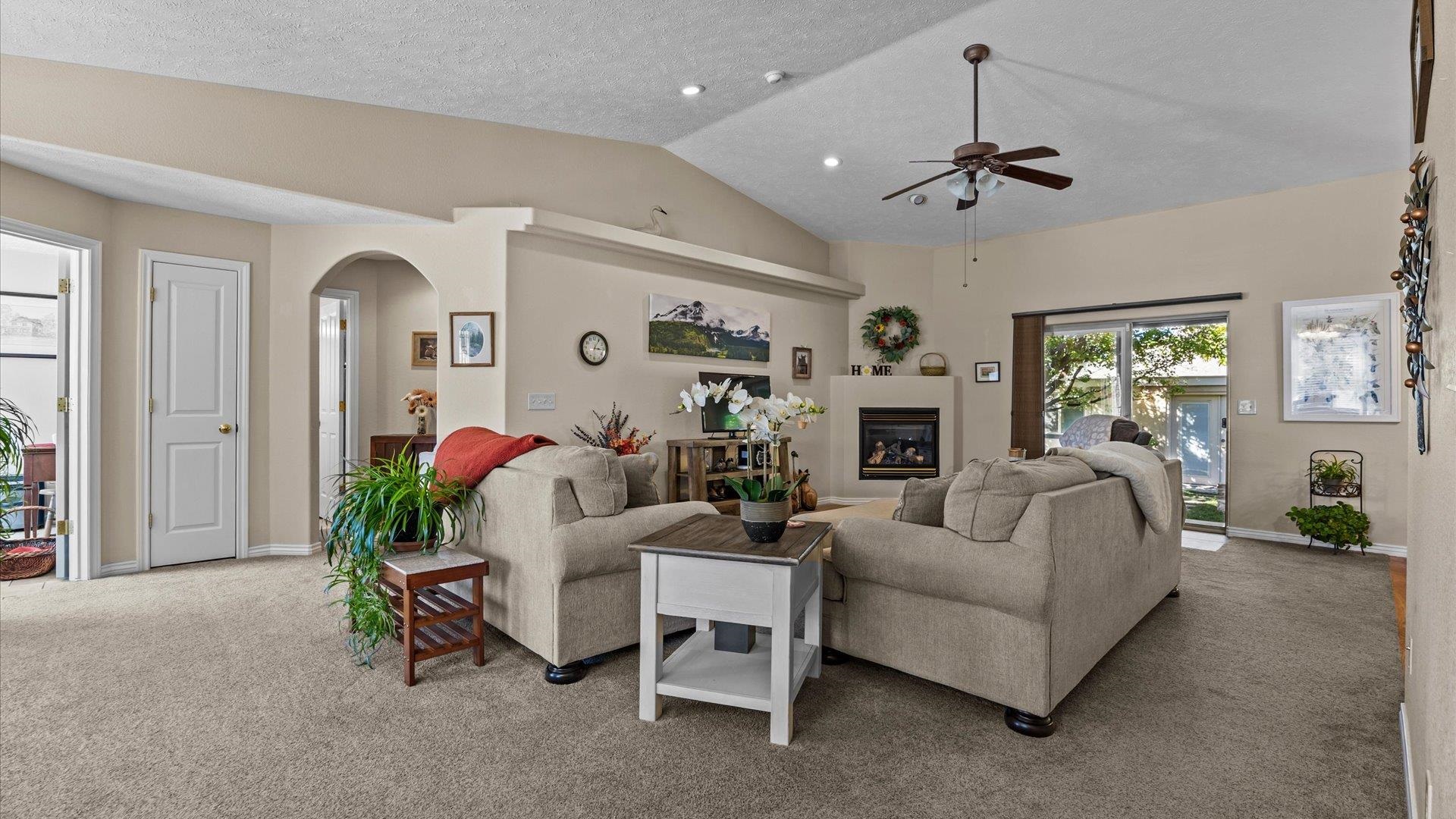1355 Monument Court Fruita, CO 81521 - Photo 6 of 27 a living room with furniture and a fireplace