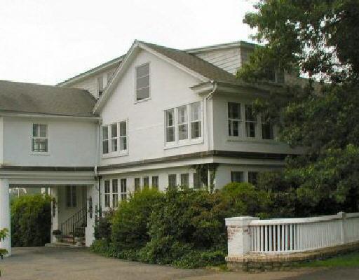 89 Old Saugatuck Road Norwalk, CT 06855 - Photo 1 of 1 a front view of a house with a garden