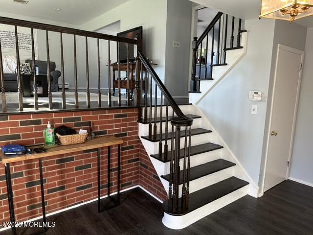 15 Cooper Avenue West Long Branch, NJ 07764 - Photo 2 of 13 a view of entryway with wooden floor and stairs