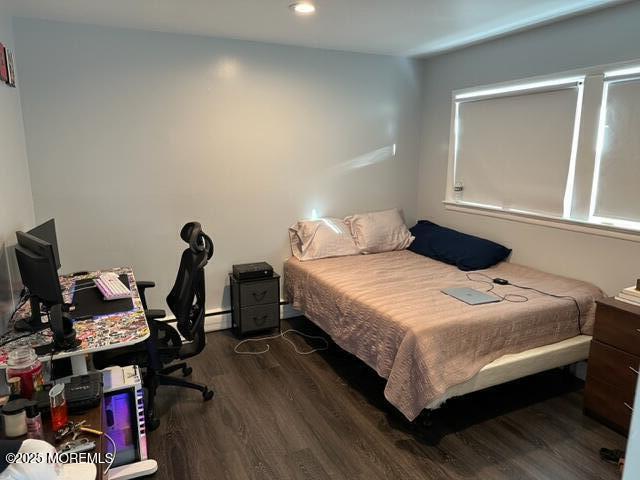 15 Cooper Avenue West Long Branch, NJ 07764 - Photo 5 of 13 a bedroom with a bed and a window