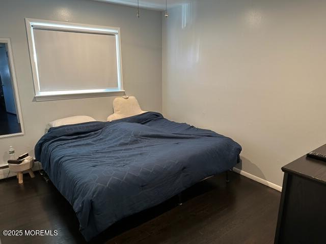 15 Cooper Avenue West Long Branch, NJ 07764 - Photo 8 of 13 a bedroom with a bed and a window