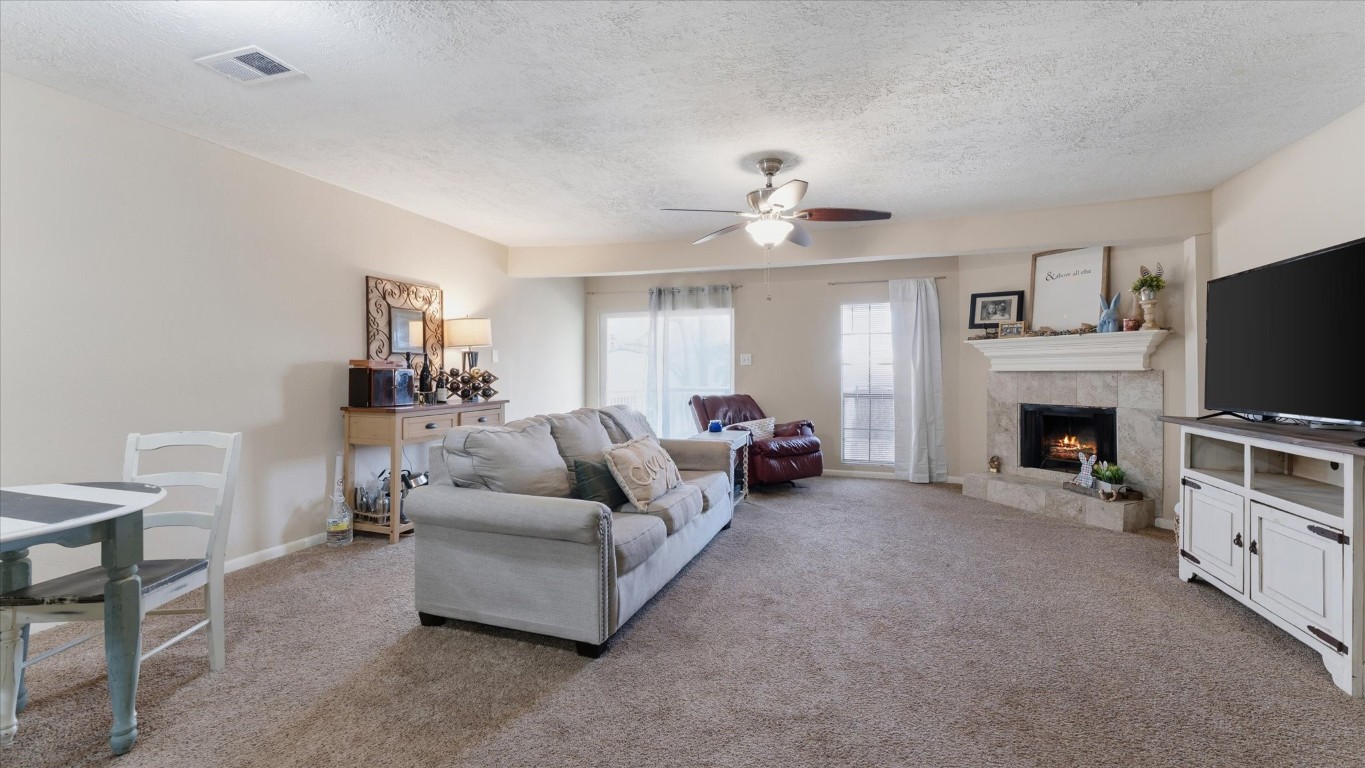 41 Regency Point Montgomery, TX 77356 - Photo 21 of 44 a living room with furniture a flat screen tv and a fireplace