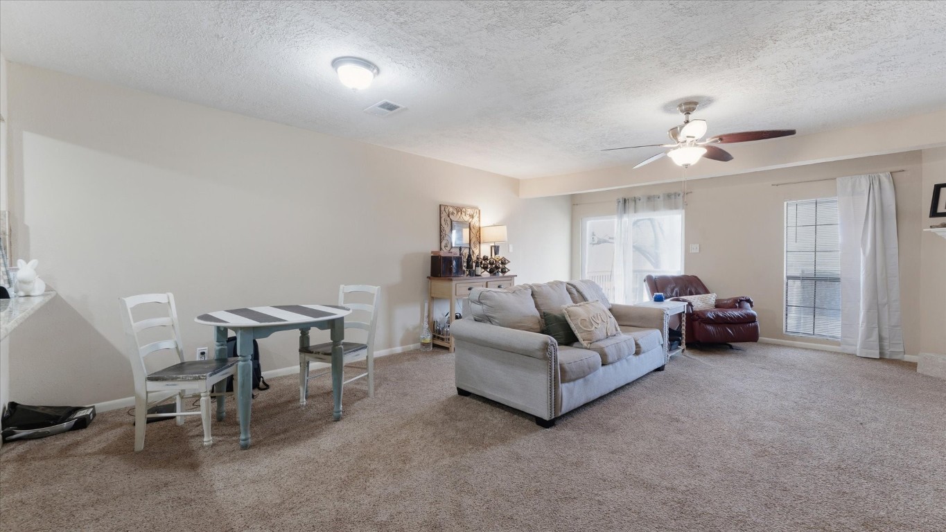 41 Regency Point Montgomery, TX 77356 - Photo 25 of 44 a living room with furniture and a chandelier