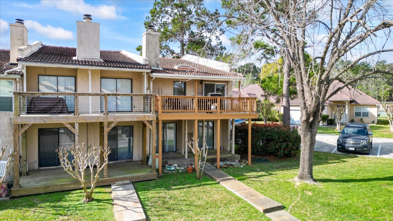 41 Regency Point Montgomery, TX 77356 - Photo 7 of 44 a front view of a house with garden