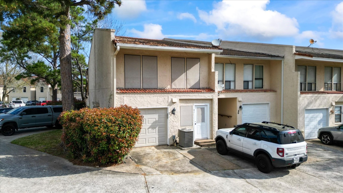 41 Regency Point Montgomery, TX 77356 - Photo 9 of 44 a car parked in front of a white house